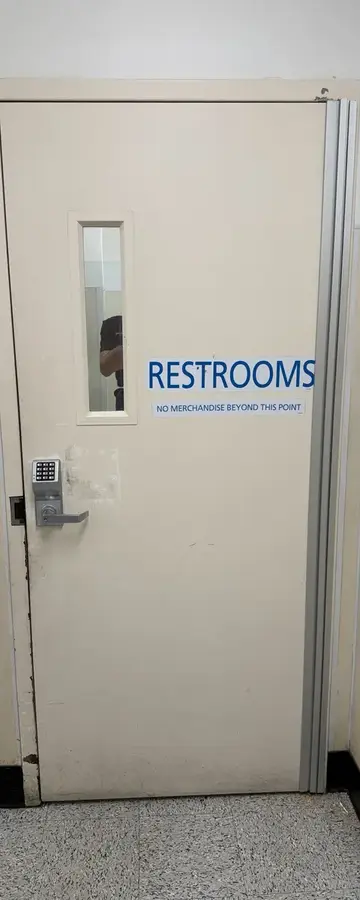 After: door with new continuous hinge closing flush at a Ross Dress for Less in Arlington