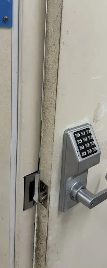 Before: door hitting the frame instead of closing at a Ross Dress for Less in Arlington