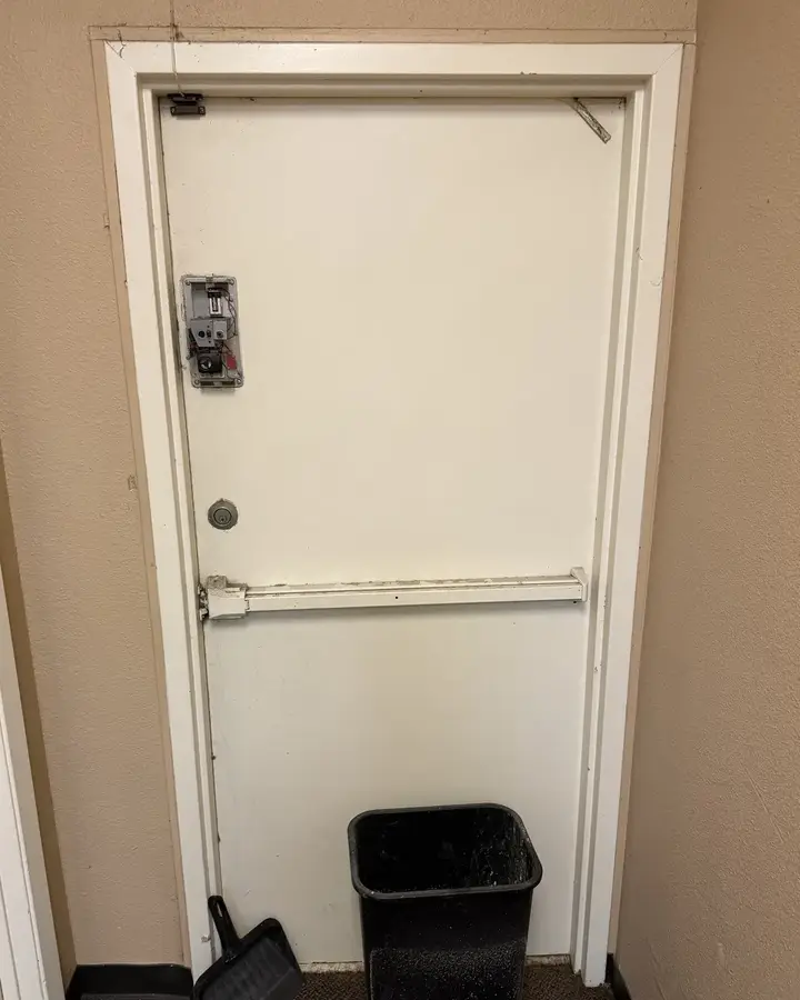 Before: old jammed back door at a TitleMax store